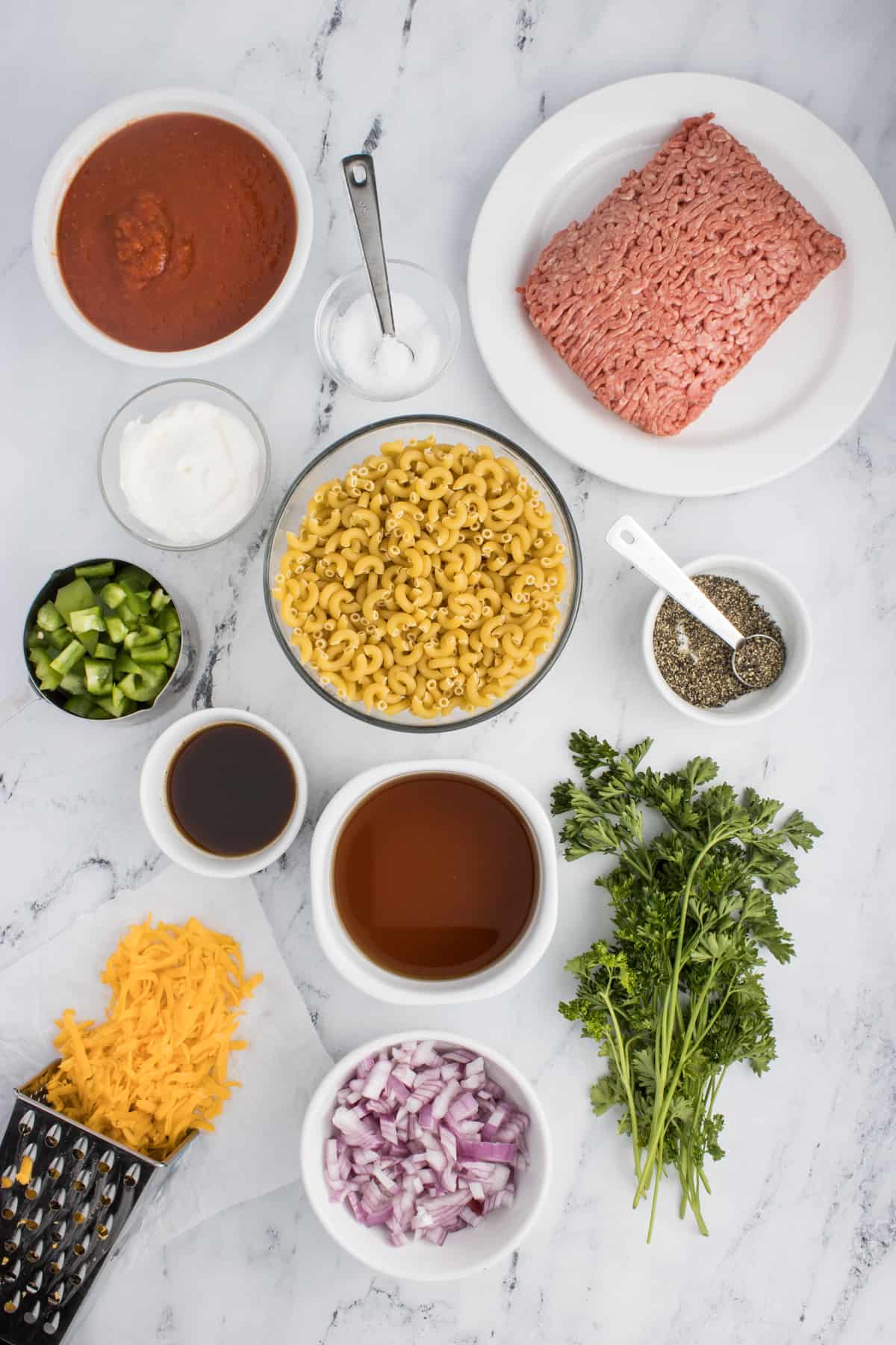 This ingredient shot specifically focuses on the key ingredients needed for the Cheesy Hamburger Casserole