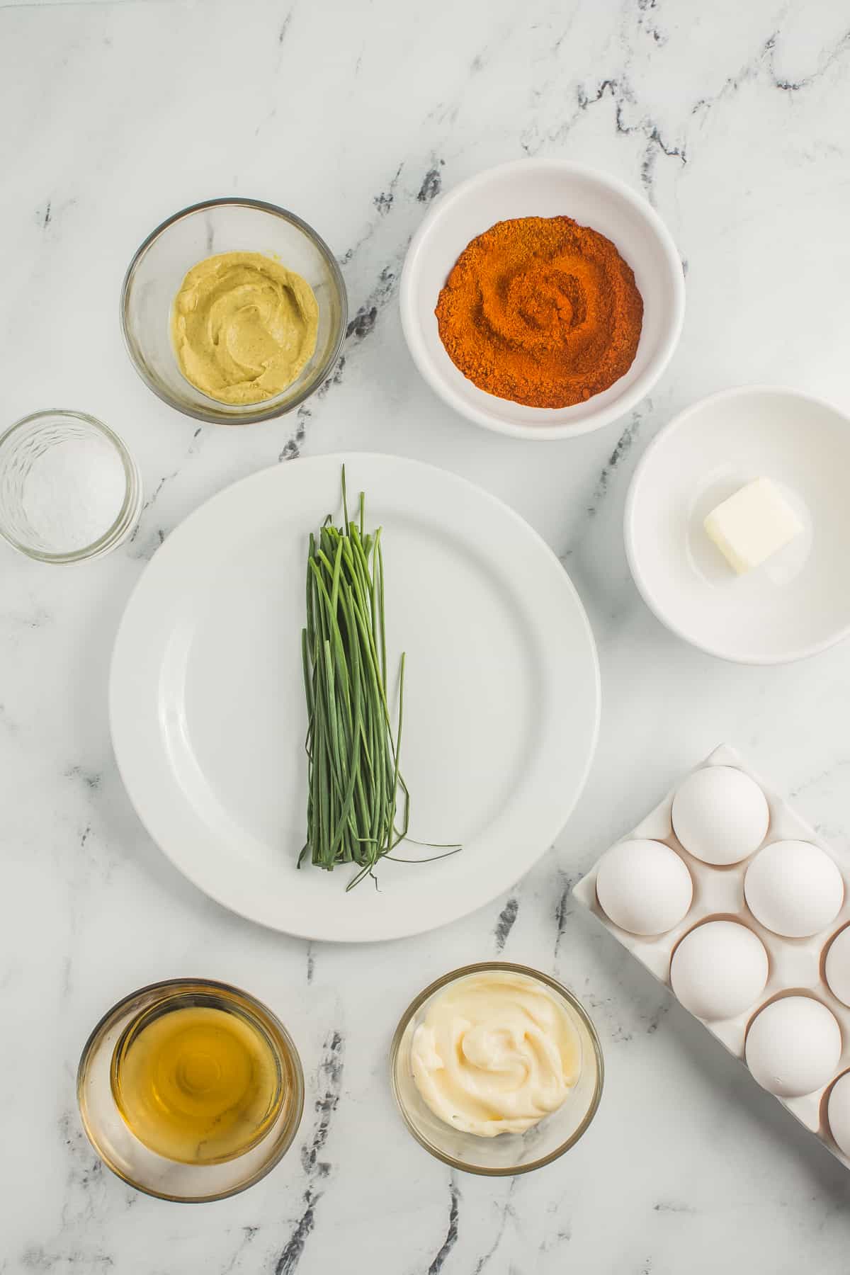 This ingredient shot focuses on the key elements required for the Deviled Eggs with Apple Cider Vinegar recipe. The ingredients are neatly presented, highlighting the components needed to prepare the delicious and tangy deviled eggs.