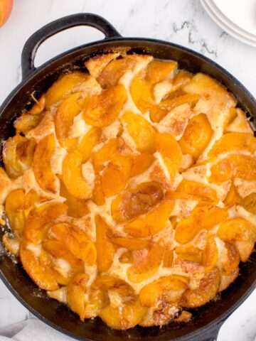 Cast iron skillet with peach cobbler
