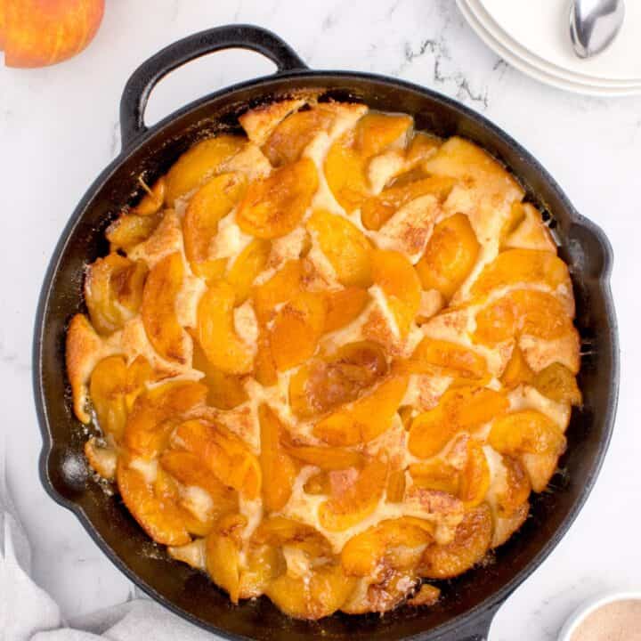Cast iron skillet with peach cobbler
