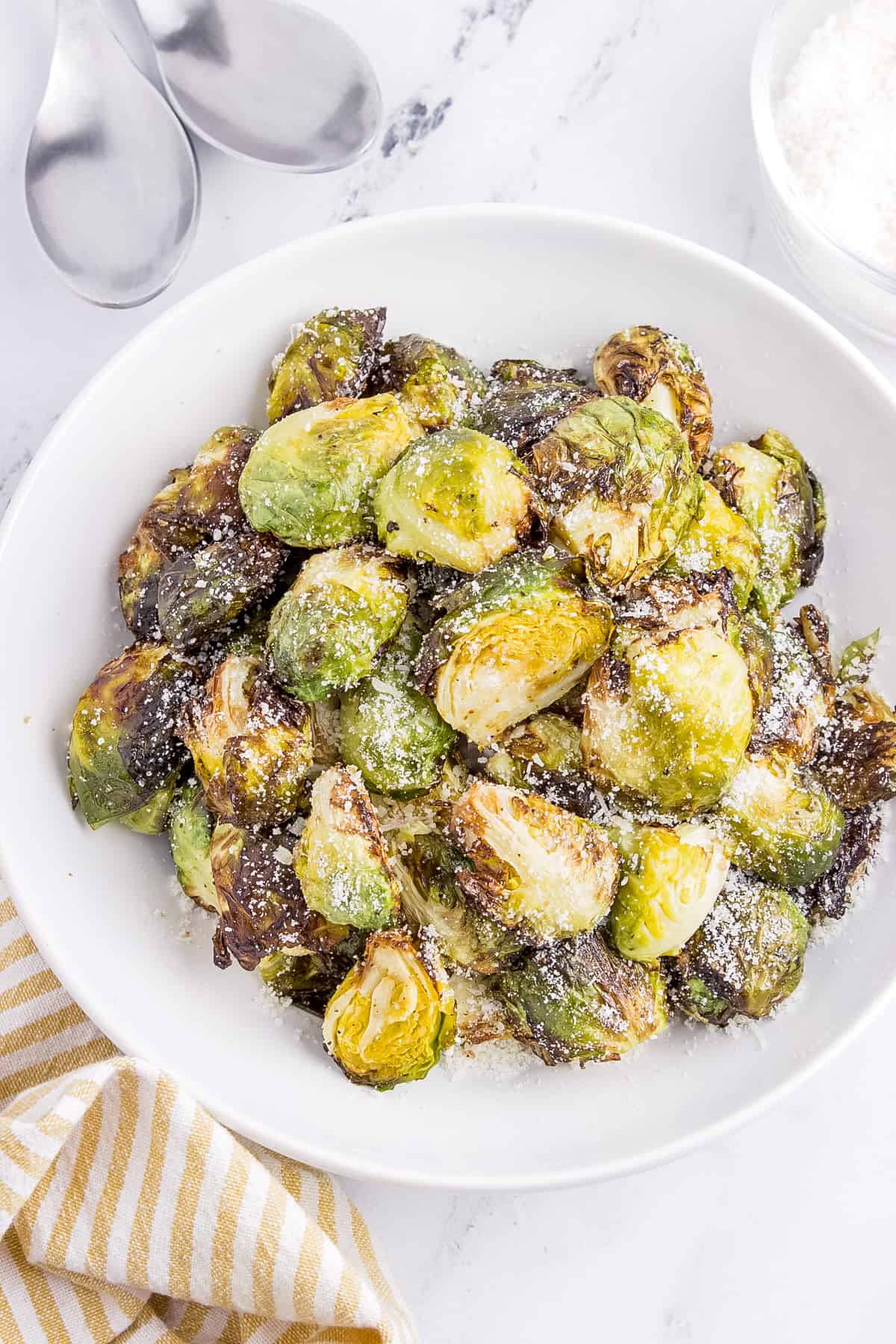 Image if Brussel Sprouts with a Balsamic glaze in a small white bowl. 