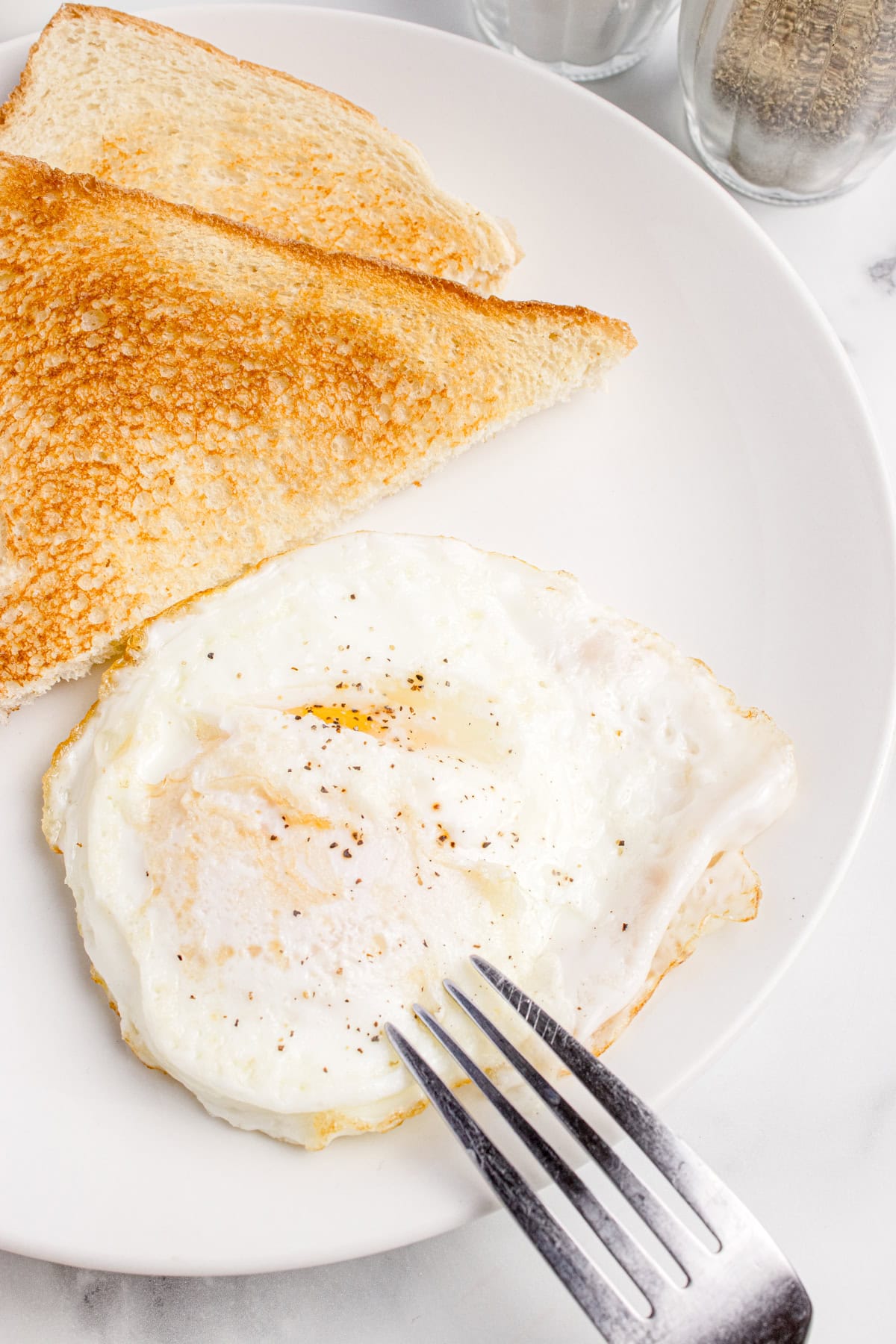 Eggs over easy in a plate