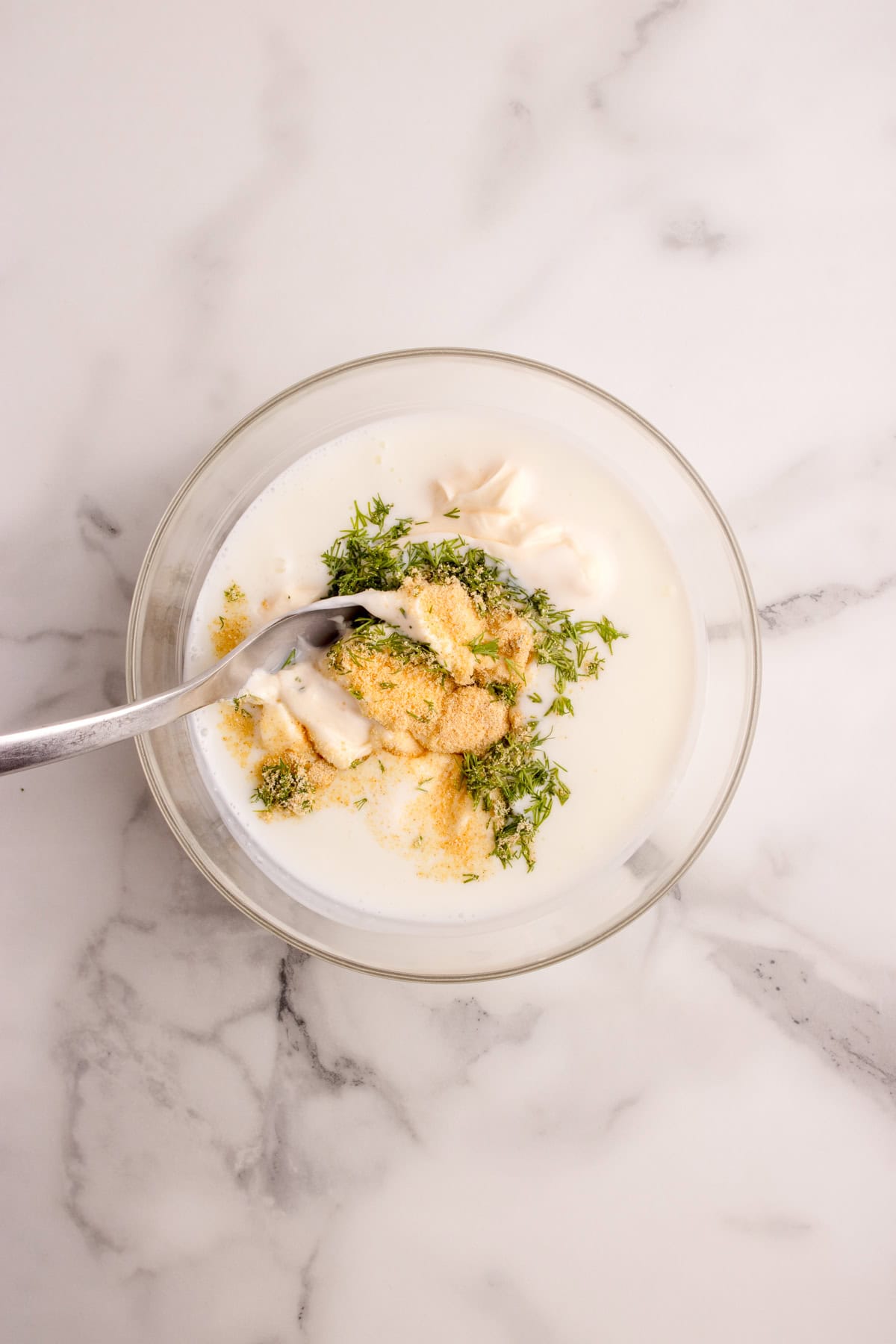 spoon combining the ingredients