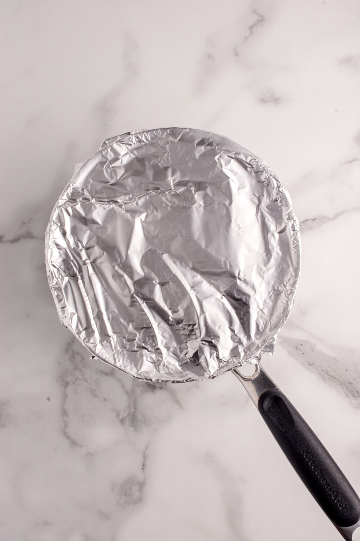 Aluminum foil covering the saucepan
