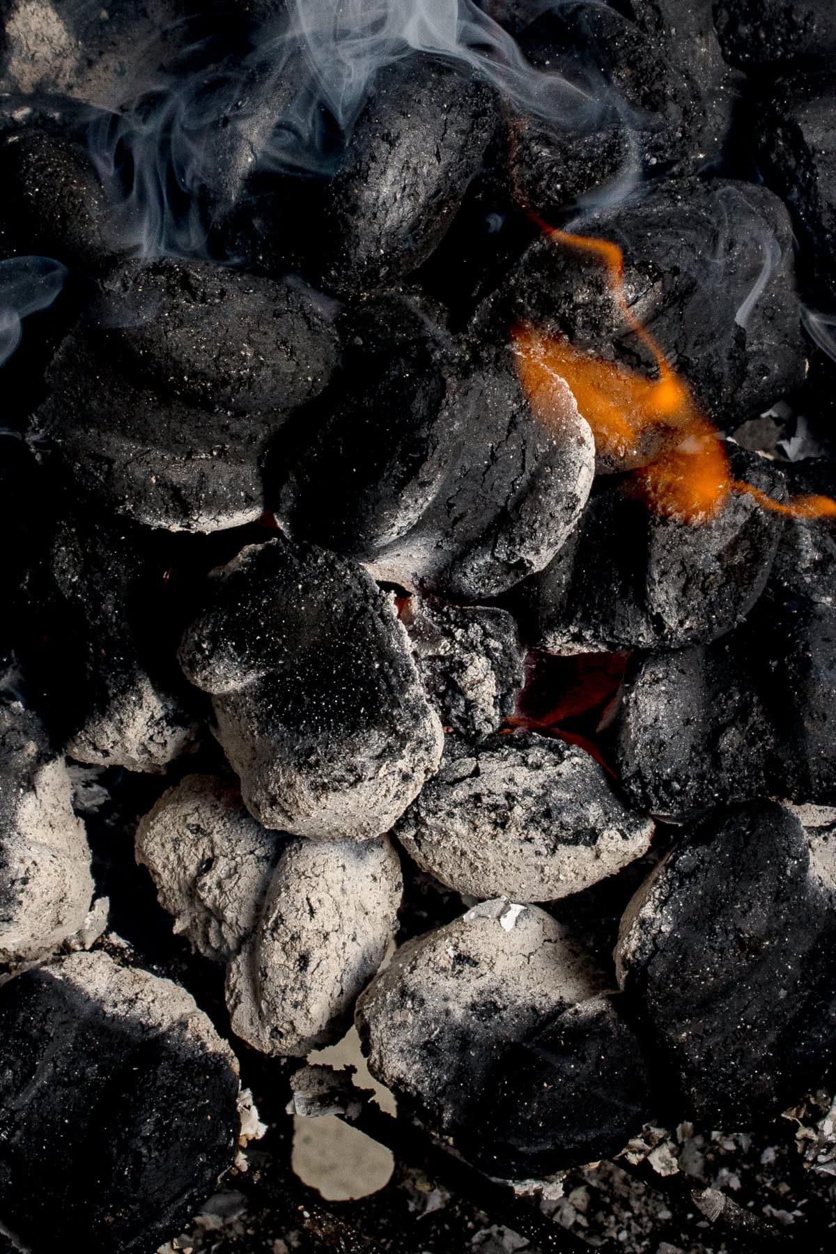 Lit charcoal briquettes.