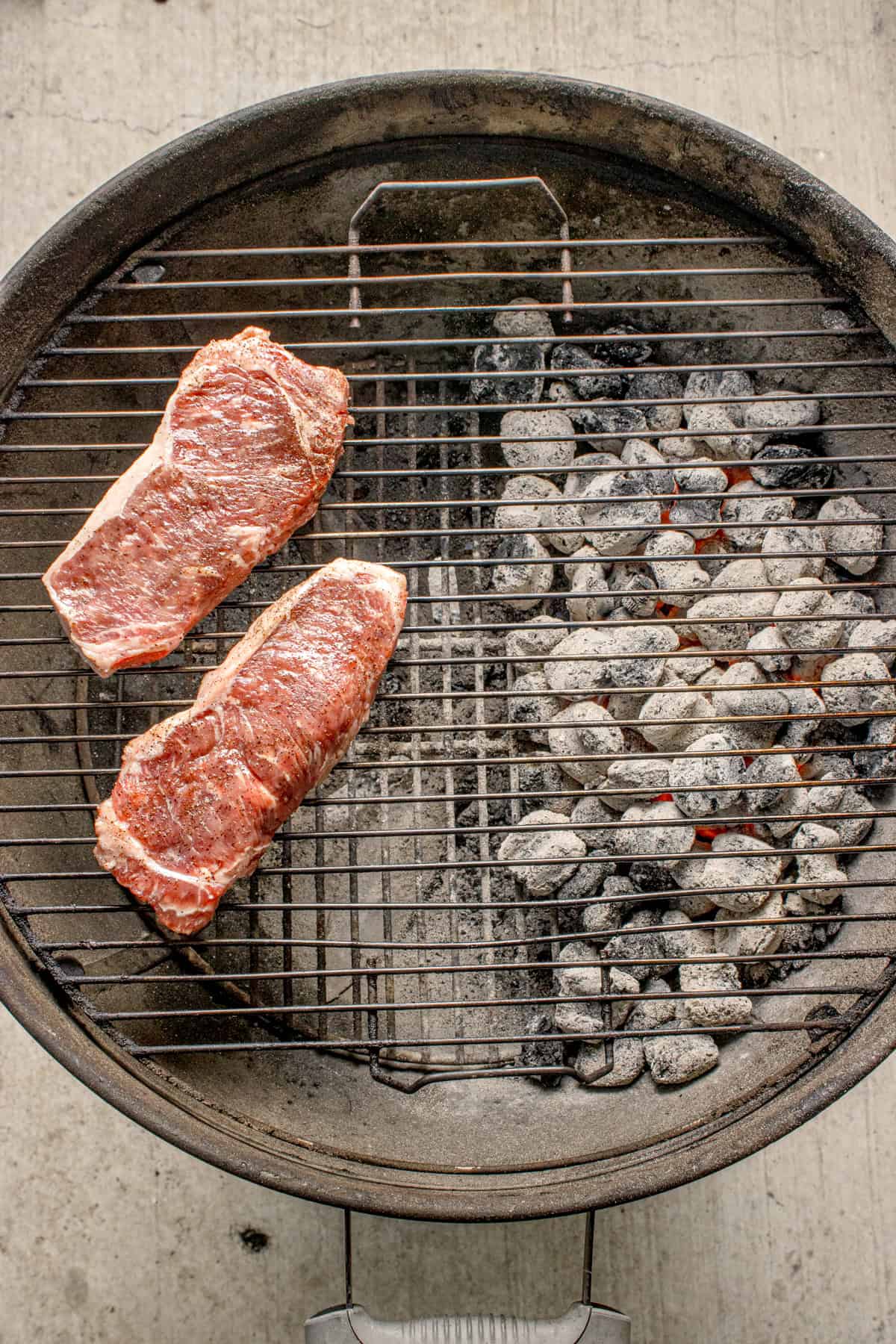 Steak on the indirect side of the grill