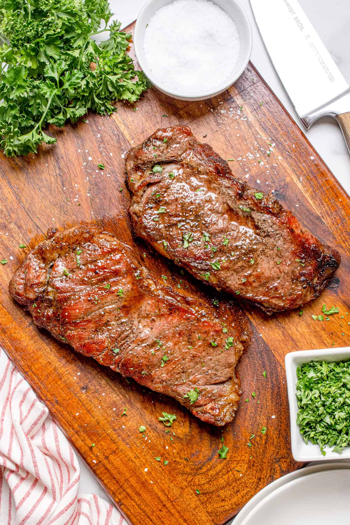 Grilled steak resting on a cutting board