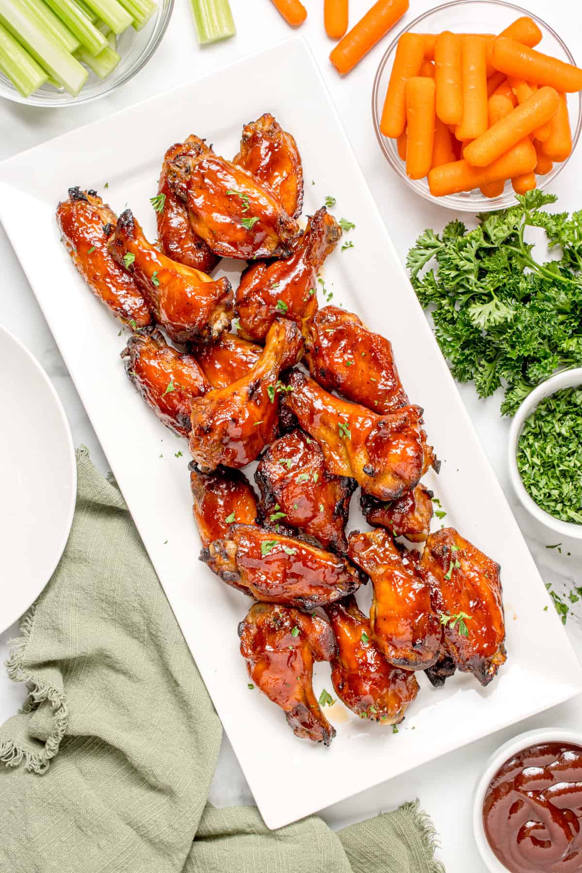 Cook chicken wings that have been plated. 