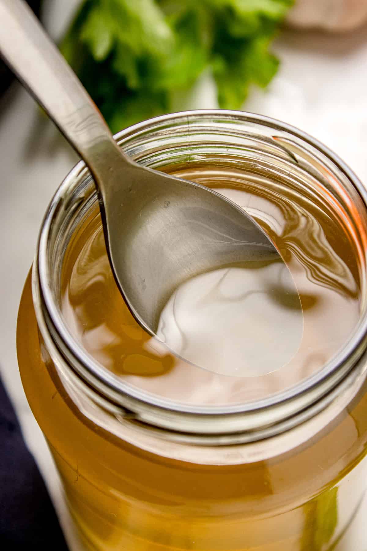 Spoon scooping out the vegetable soup 