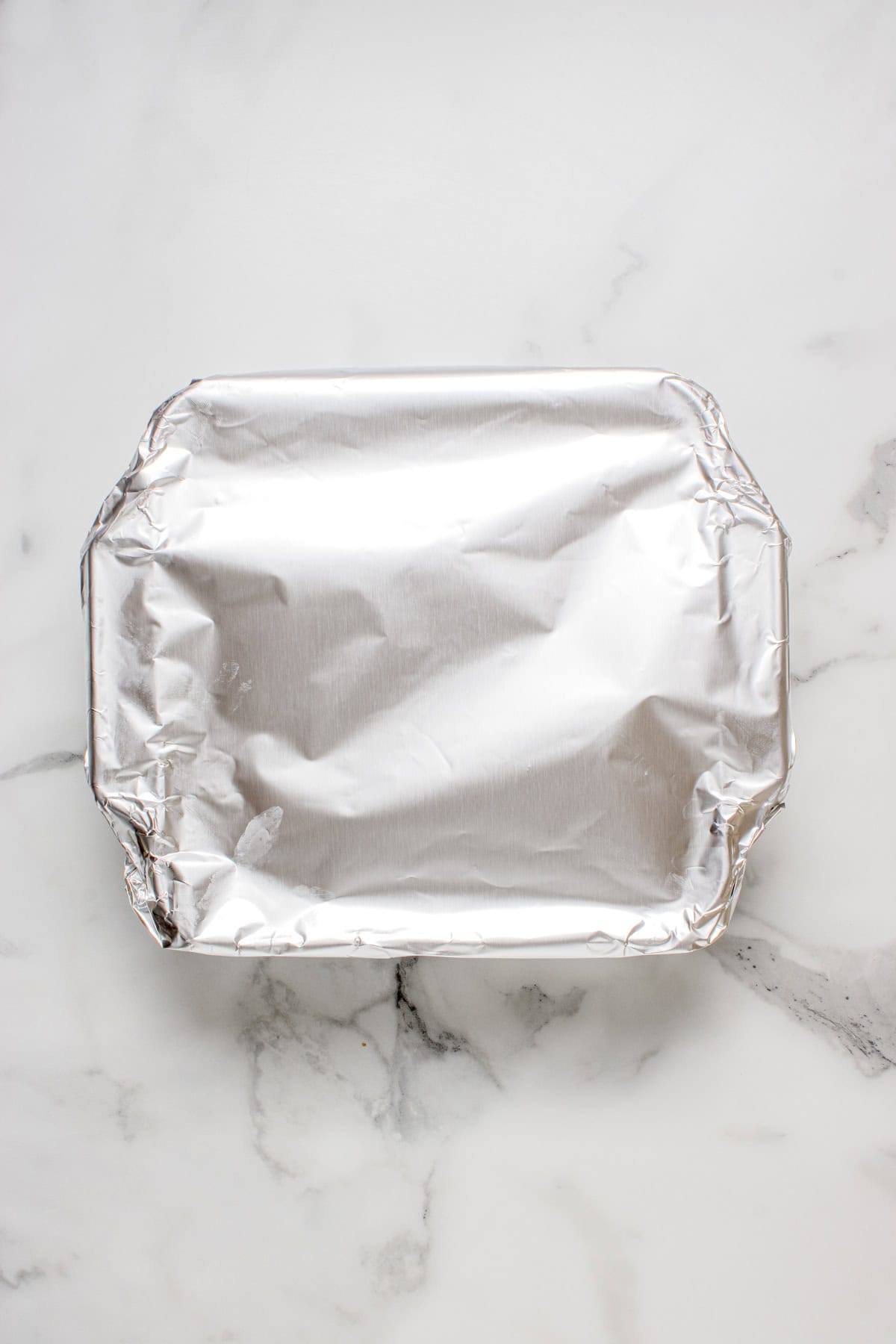 Foil covering the chicken salad casserole