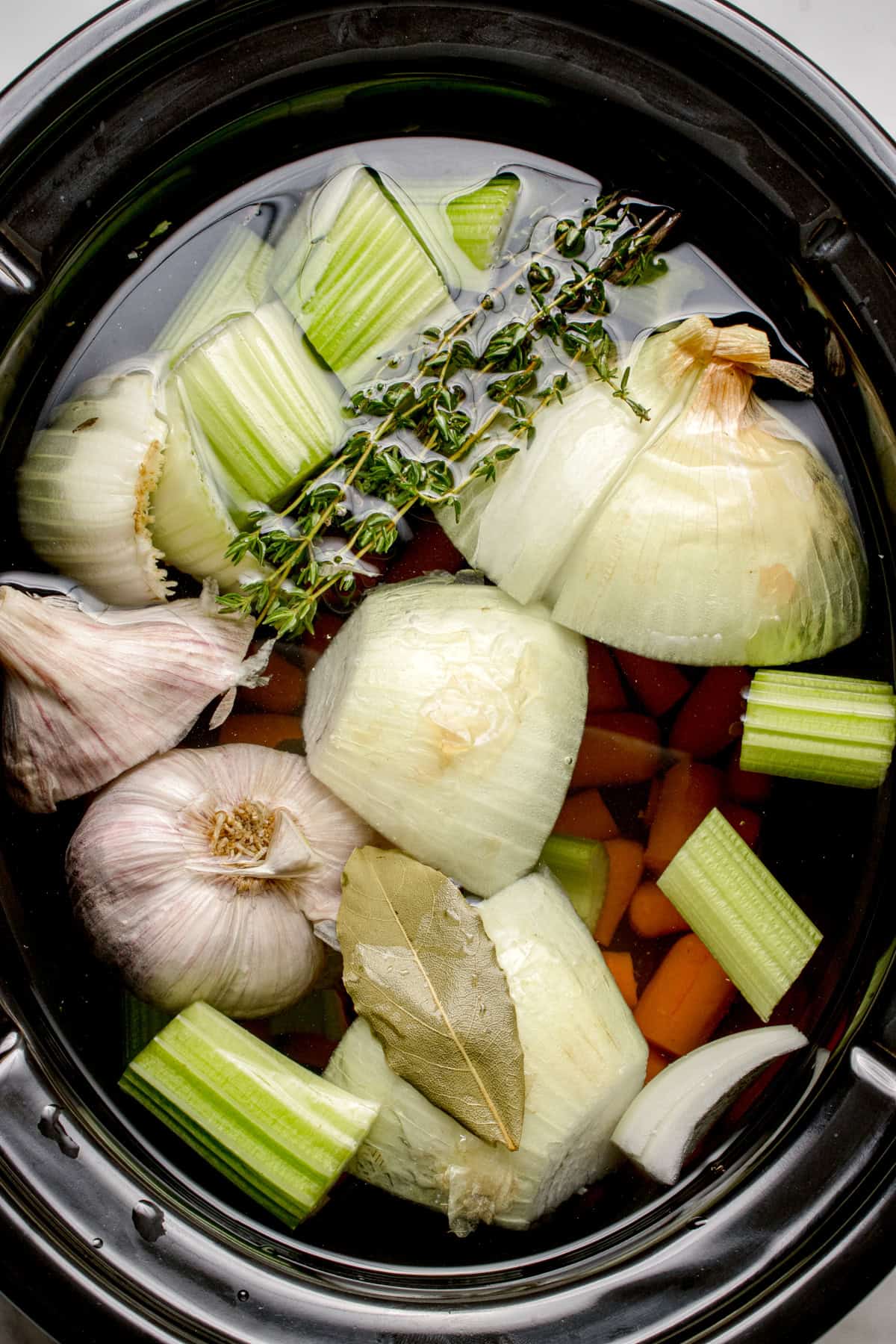 Ingredients for this vegetable soup recipe in a slow cooker. 